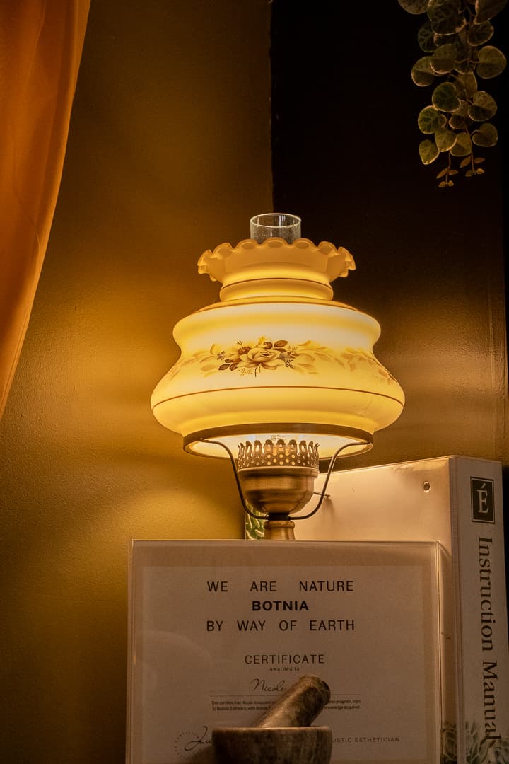 Vintage oil lamp above the Botnia certificate